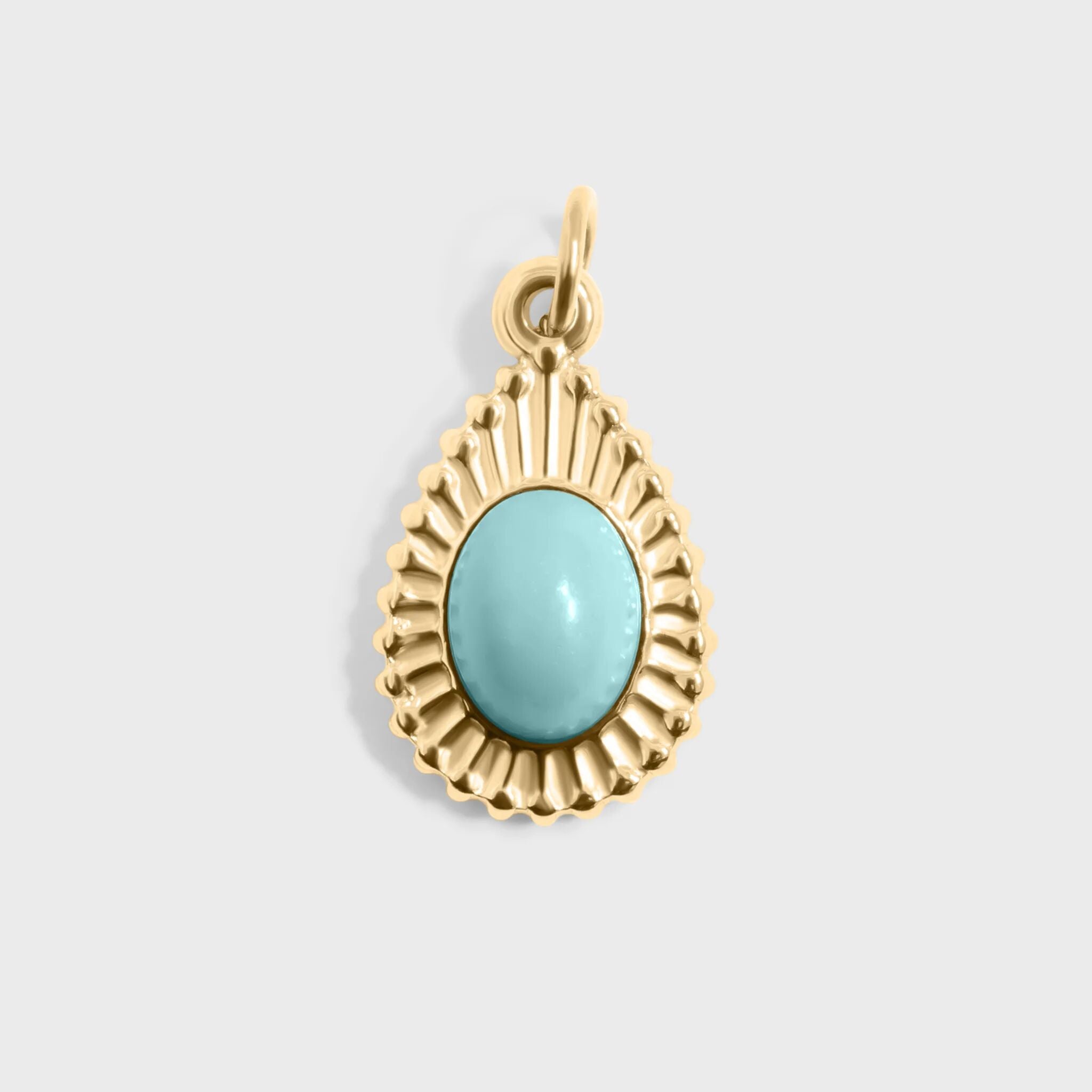 Gold pendant with a turquoise stone on a light gray background
