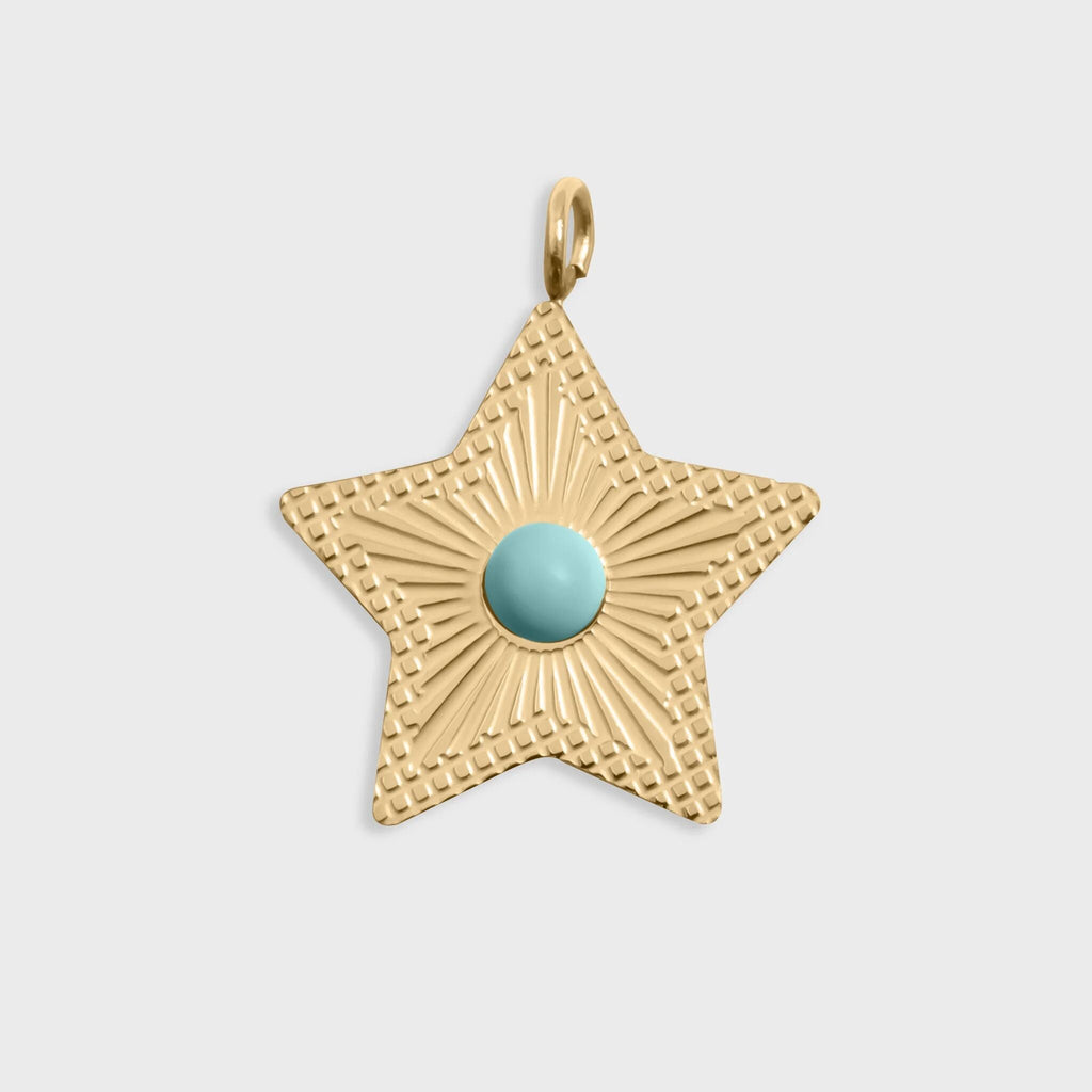 Gold star-shaped pendant with a turquoise center on a light gray background