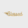 Gold 'Blessed' pendant on a white background
