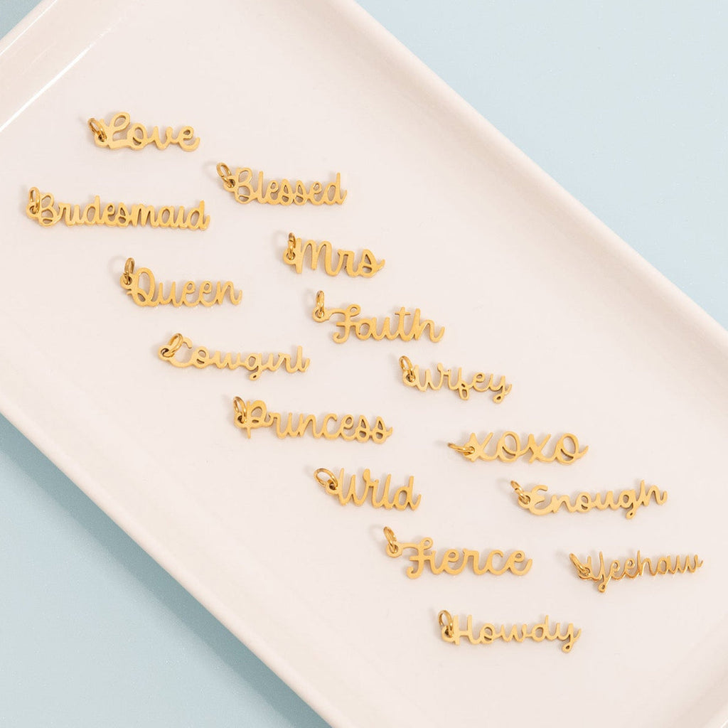 Gold decorative words on a white surface with a light blue background