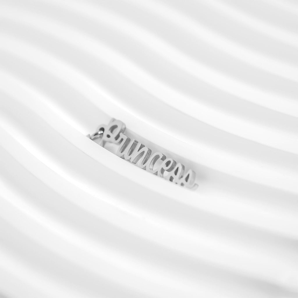 Silver necklace with a brand name on a white background