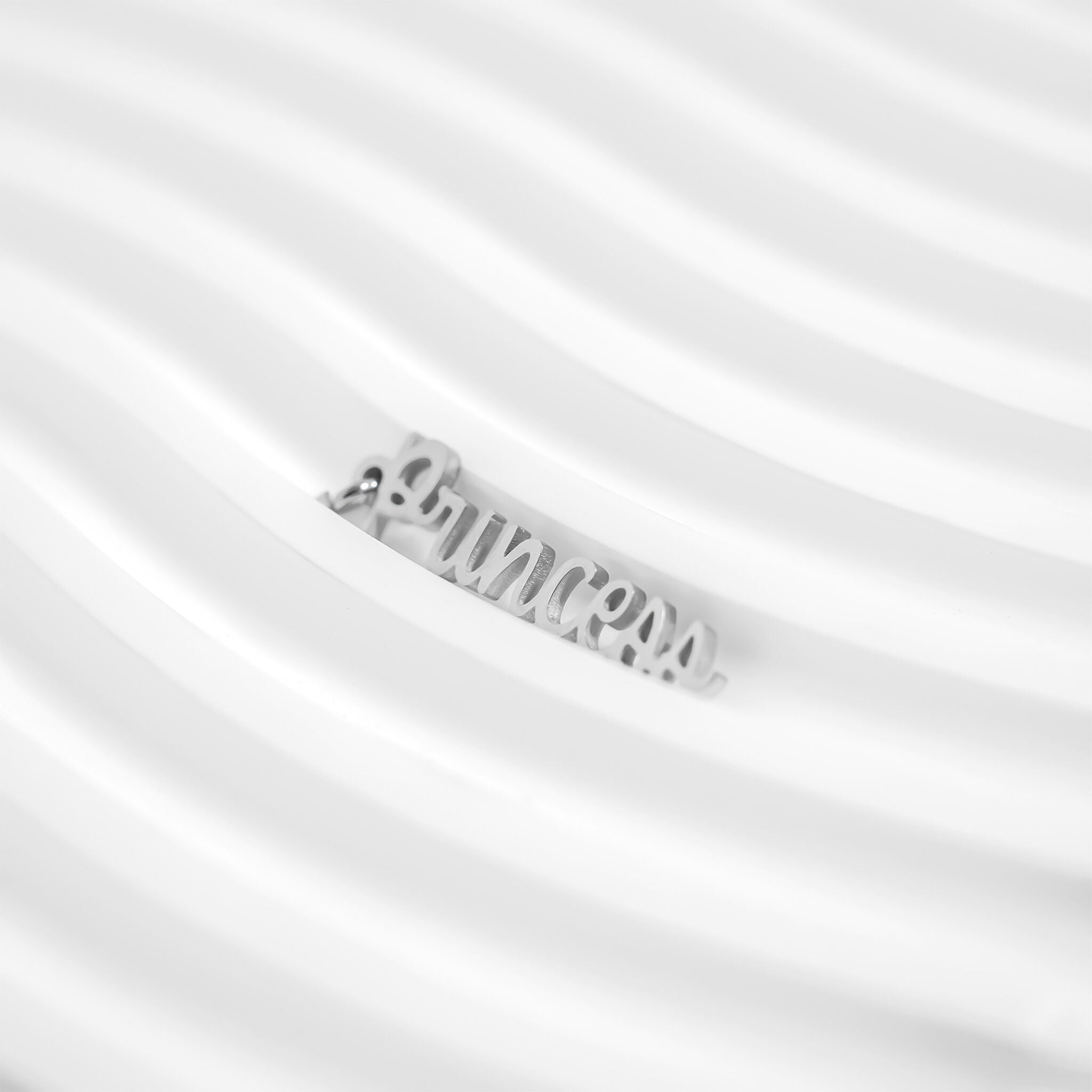 Silver necklace with a brand name on a white background