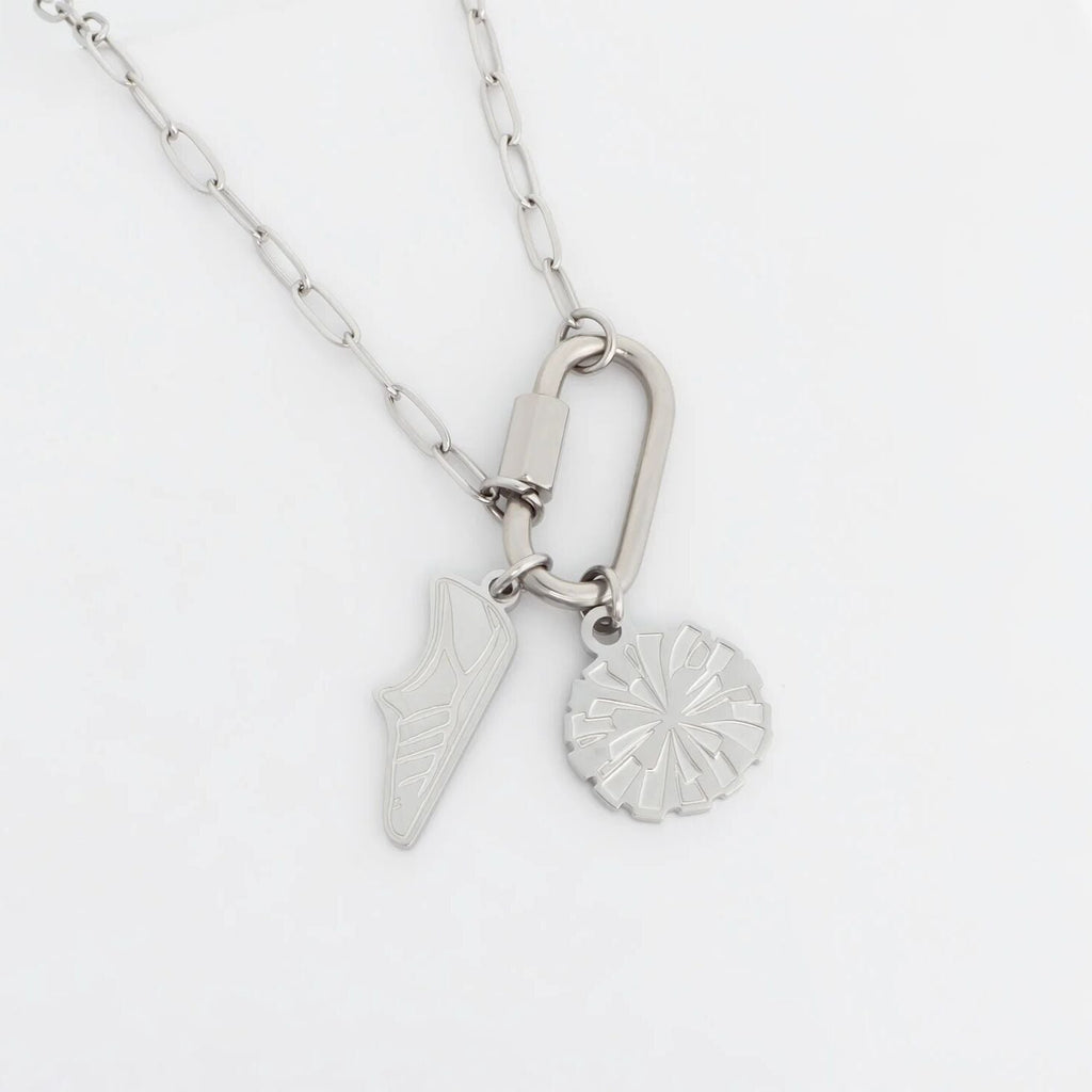 Silver necklace with two pendants on a white background
