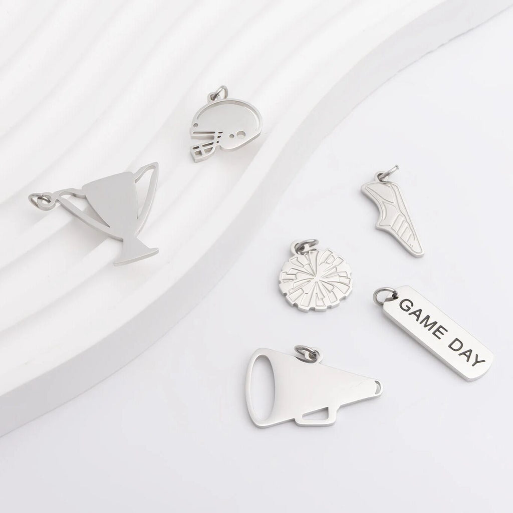 Collection of silver charms on a white background