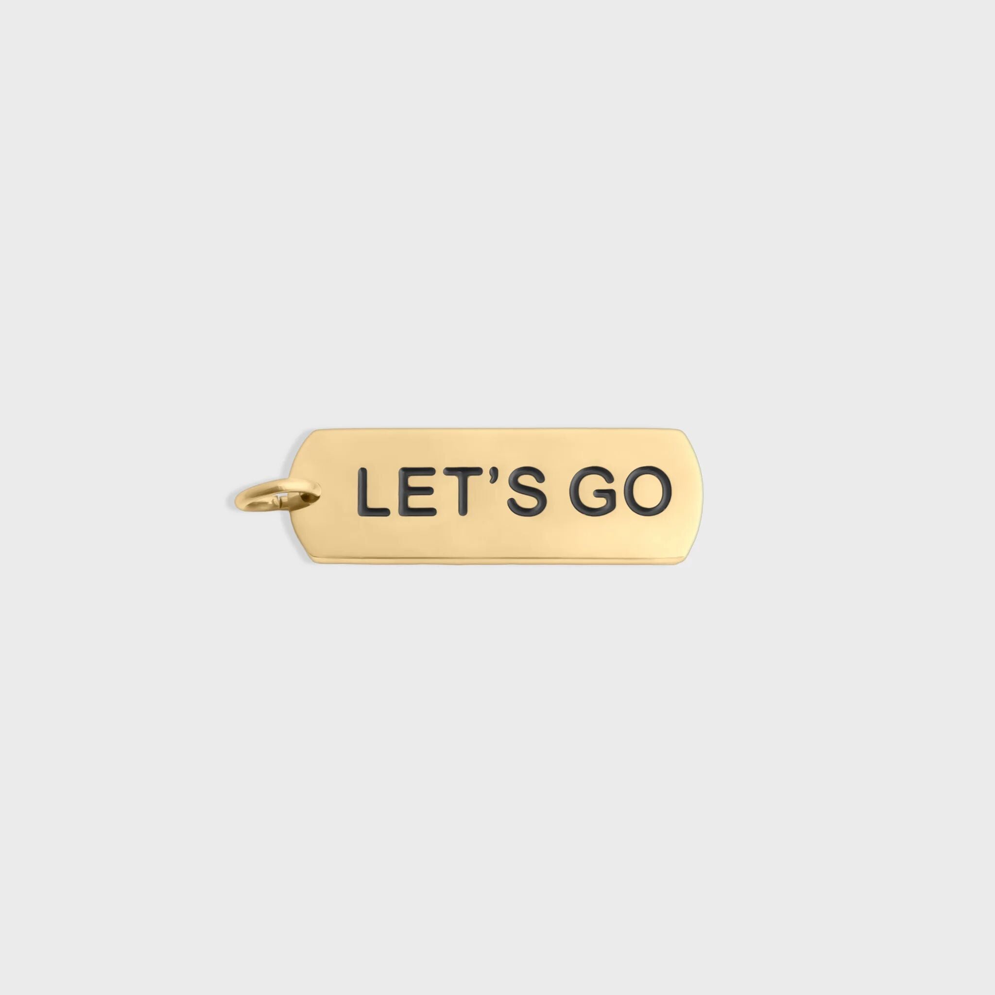 Gold pendant with 'LET'S GO' text on a light gray background