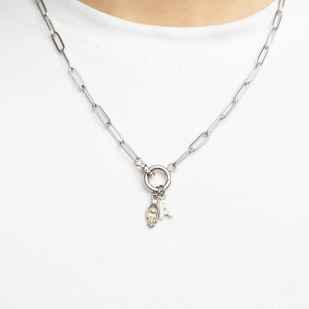 Silver necklace with a pendant on a white background