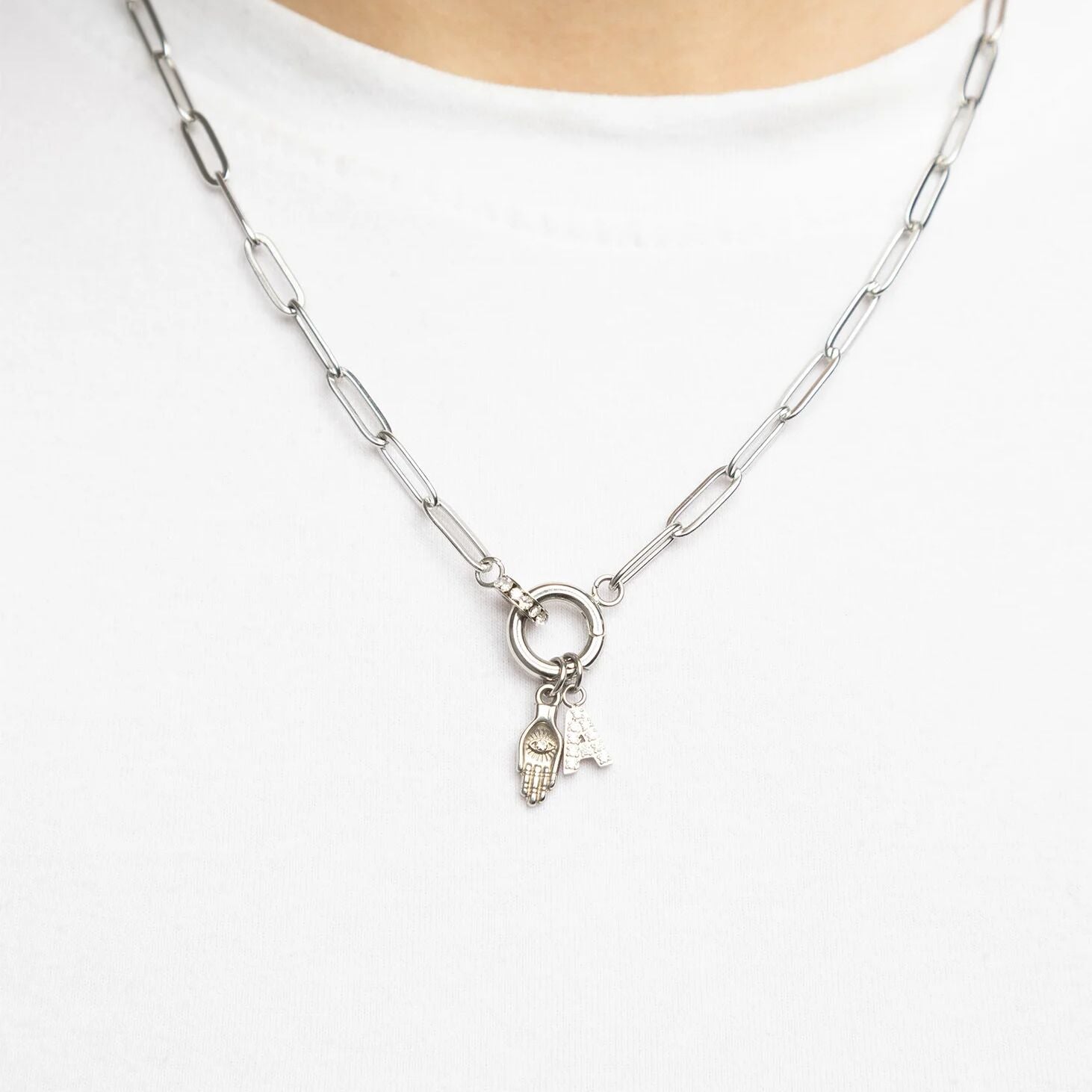 Silver necklace with a pendant on a white background