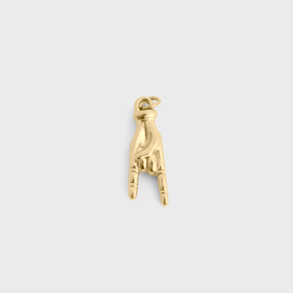 Gold and white beaded charm on a light gray background