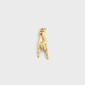 Gold and white beaded charm on a light gray background