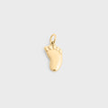 Gold baby foot-shaped charm on a light gray background