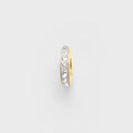 Gold spacer bead with embedded cz stones on a light gray background