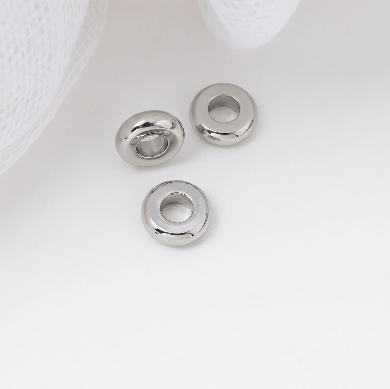 Three spacer beads on a white background