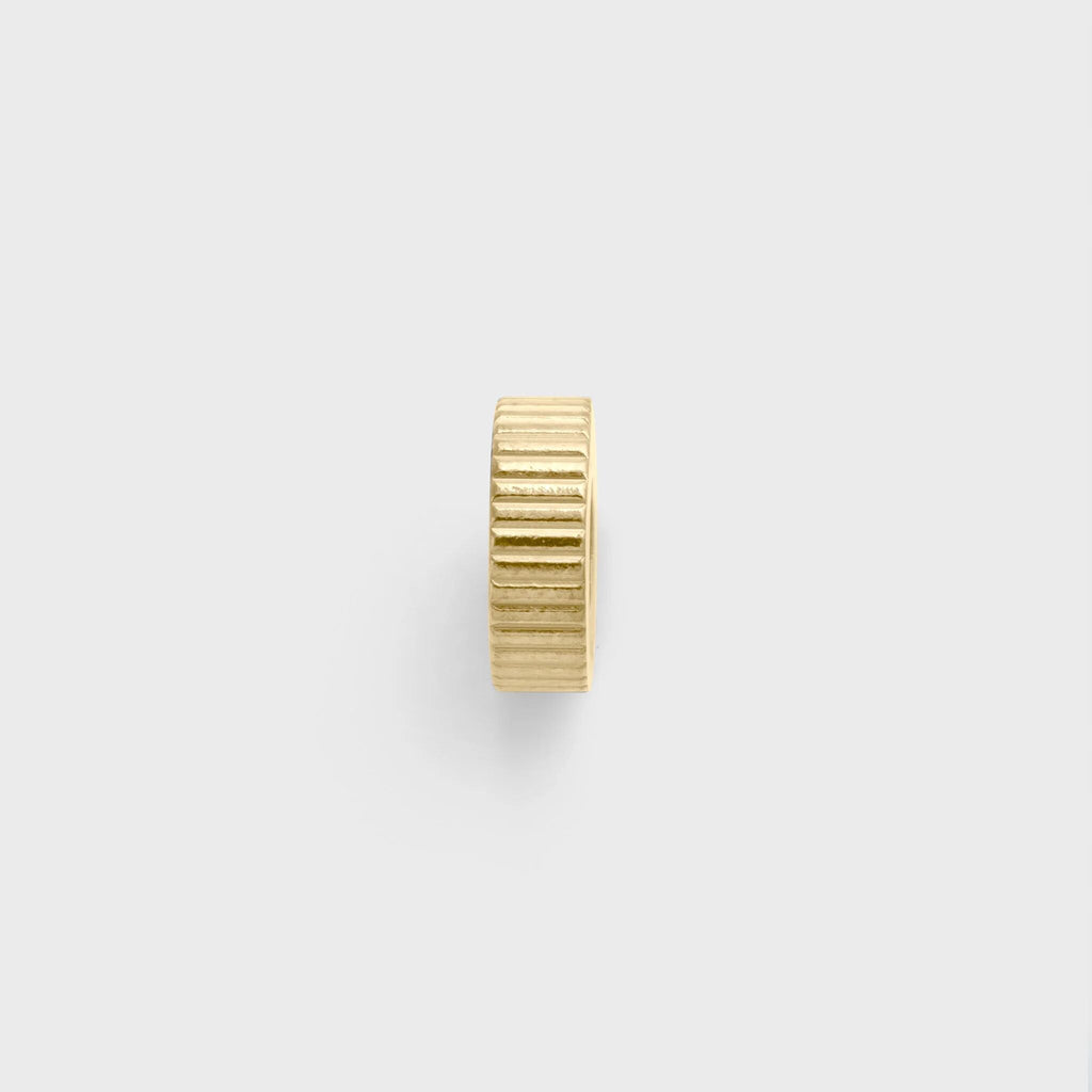 Gold spacer bead on a white background