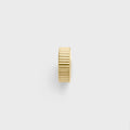 Gold spacer bead on a white background