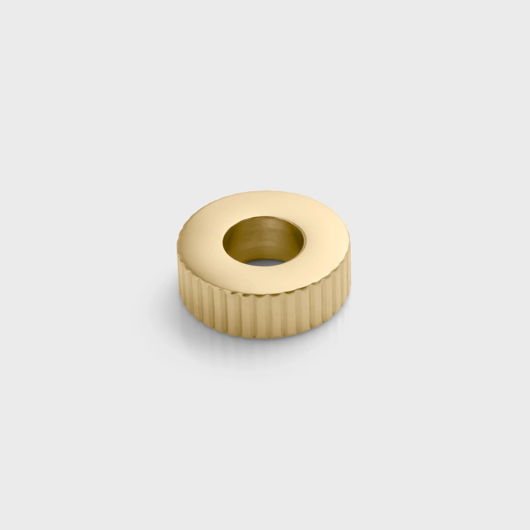 Gold fluted spacer beads on a light gray background