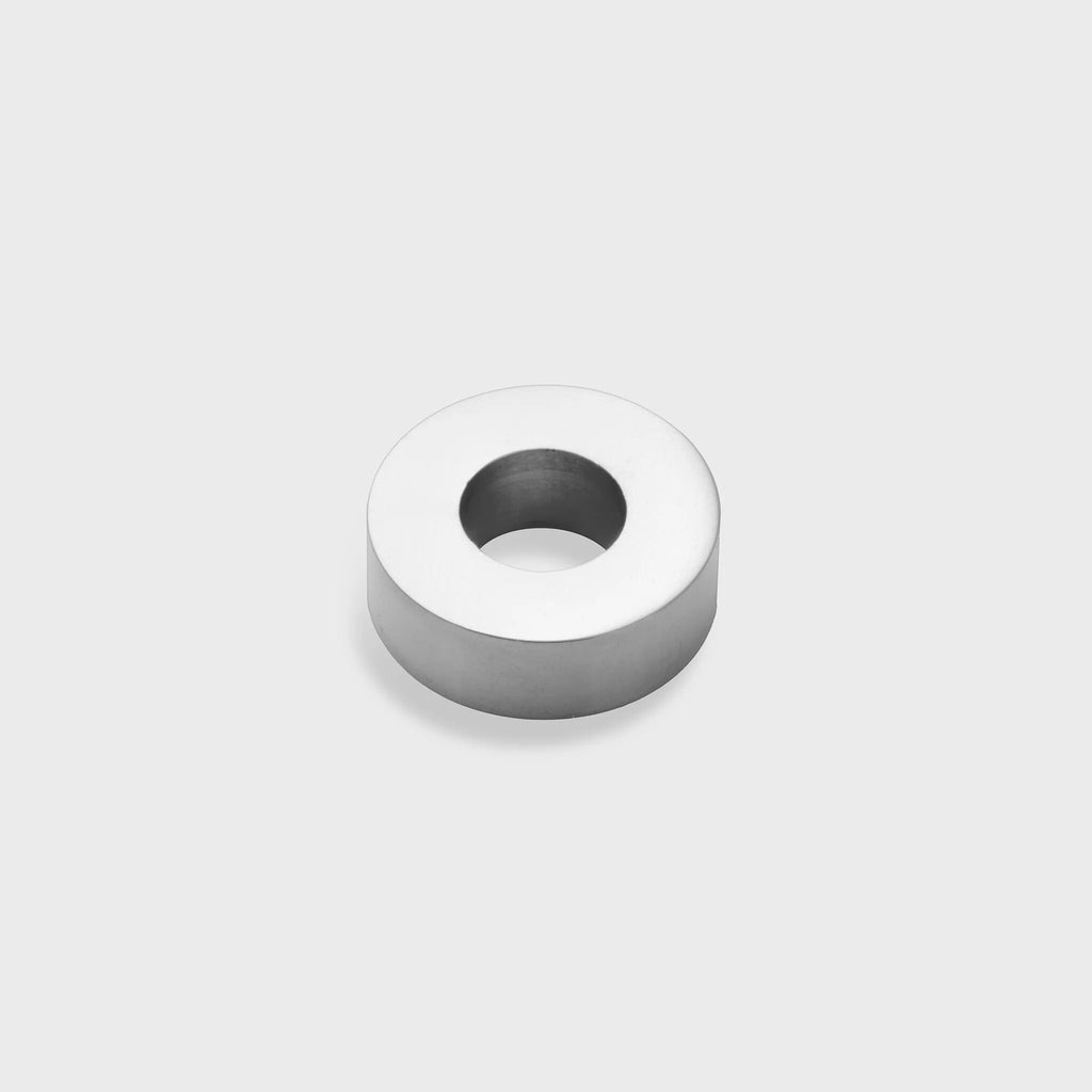 Silver spacer bead on a light gray background