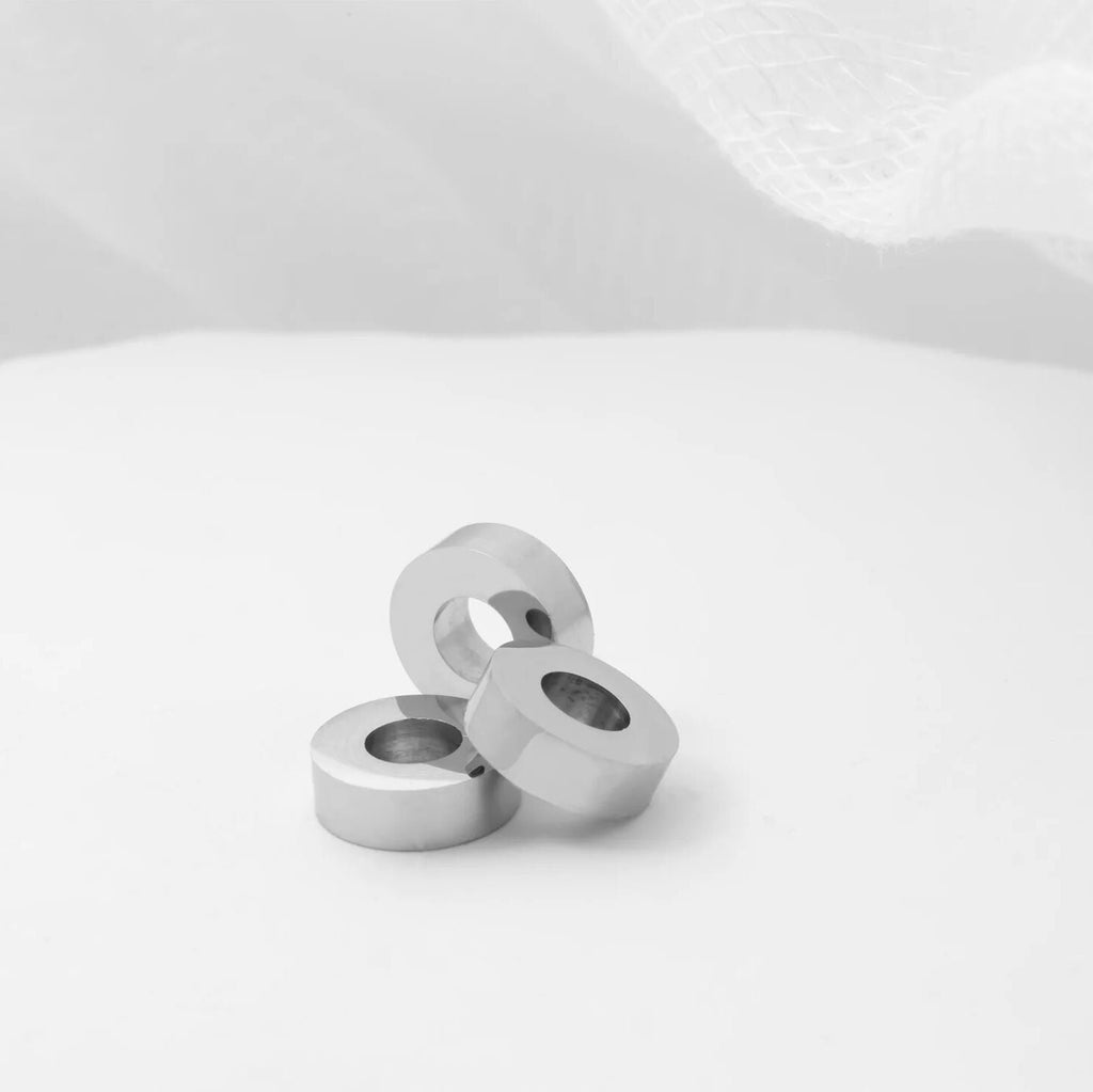 Three spacer beads on a white background