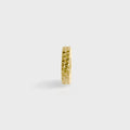 Gold textured spacer bead on a light gray background