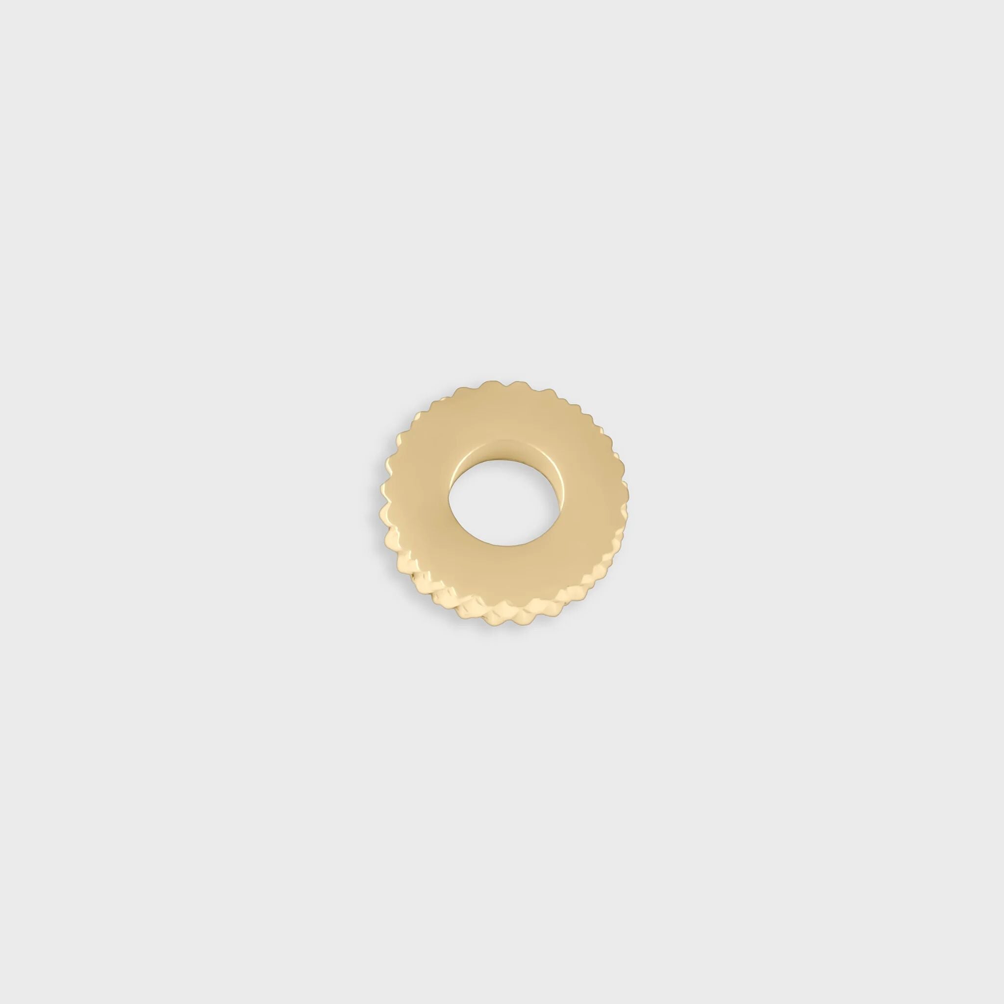 Gold textured spacer bead on a light gray background