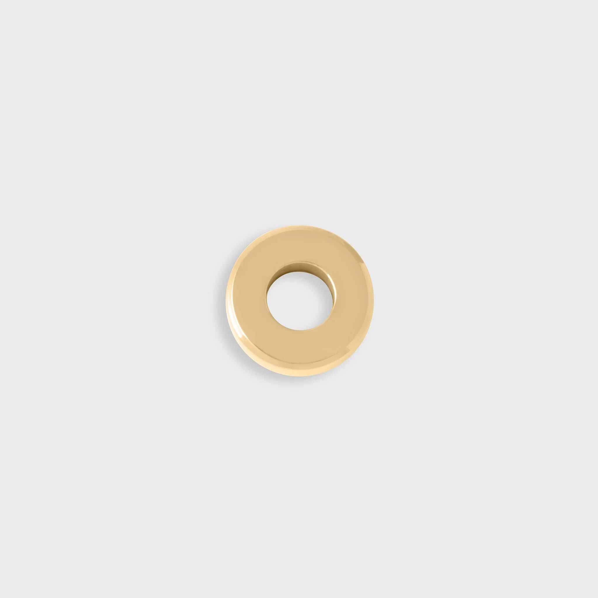 Gold spacer bead on a light gray background
