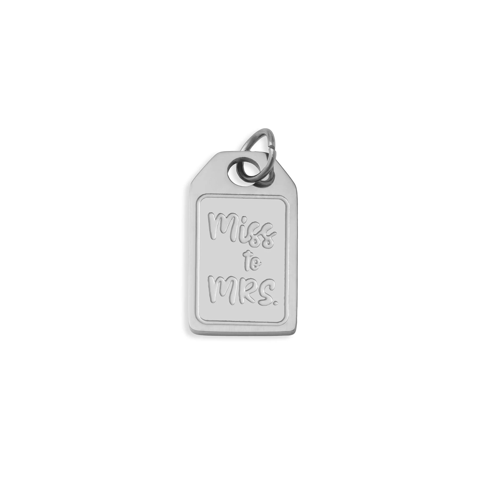 Silver pendant with 'Miss to Mrs.' engraving on a white background