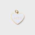 Heart-shaped pendant with 'MRS' on a light gray background