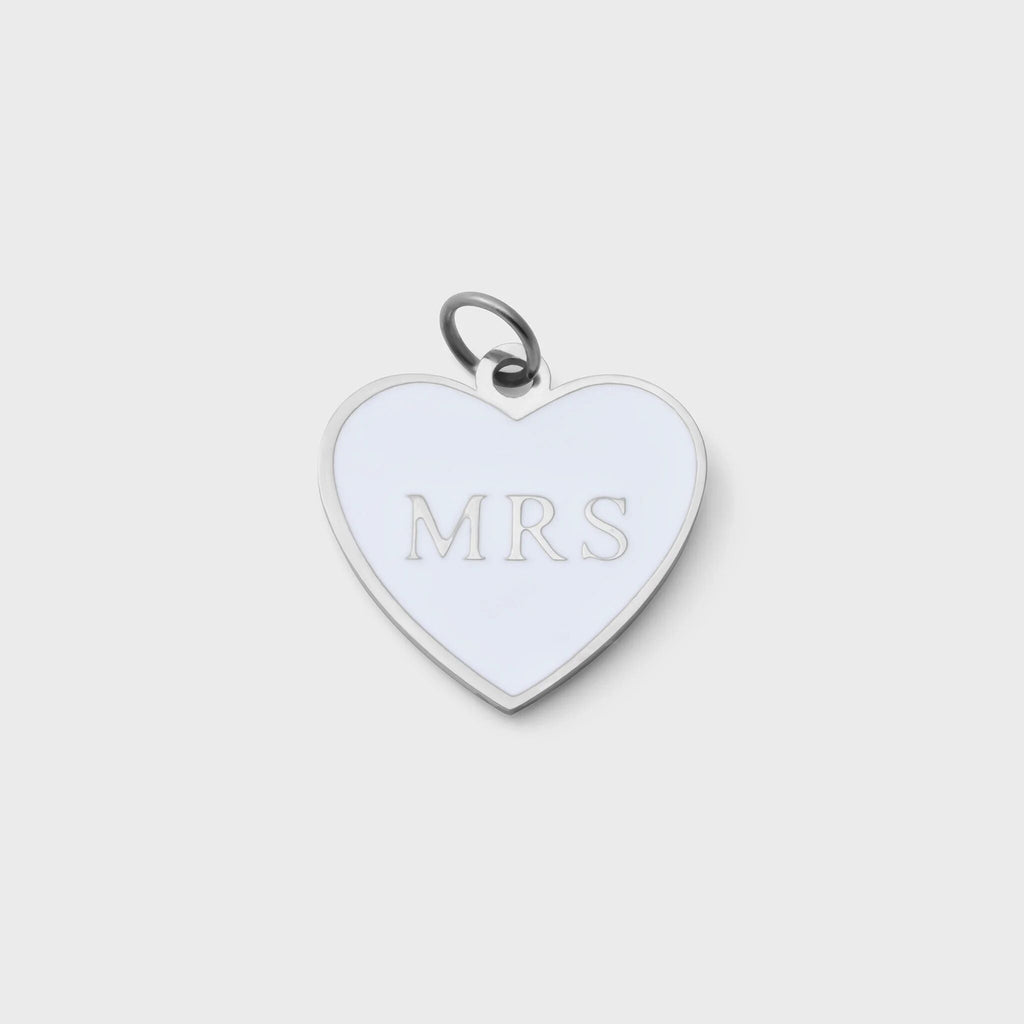 Heart-shaped pendant with 'MRS' engraving on a light gray background