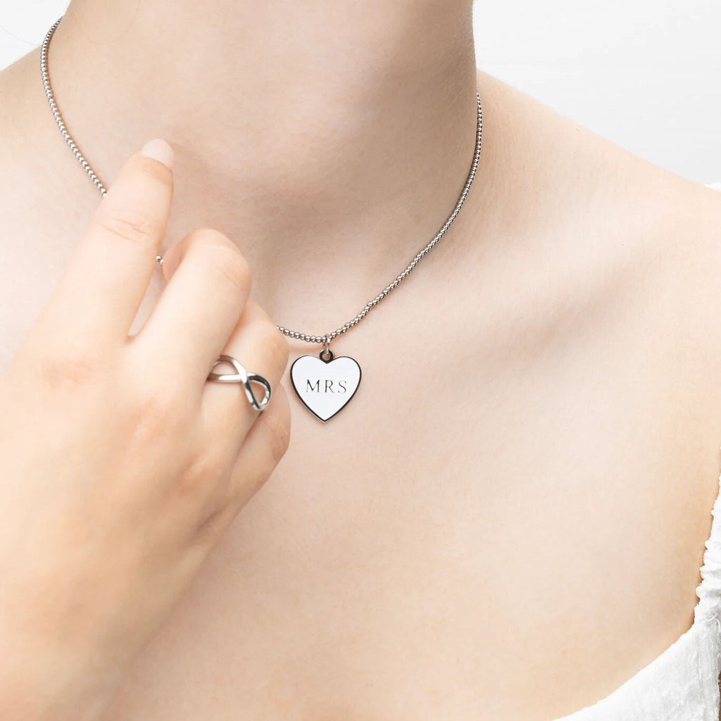 Heart-shaped pendant necklace with 'MRS'