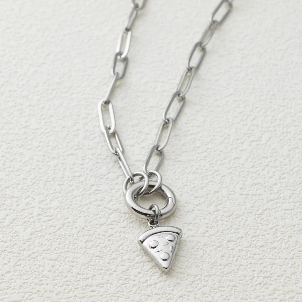 Silver necklace with a pizza slice charm on a light gray background