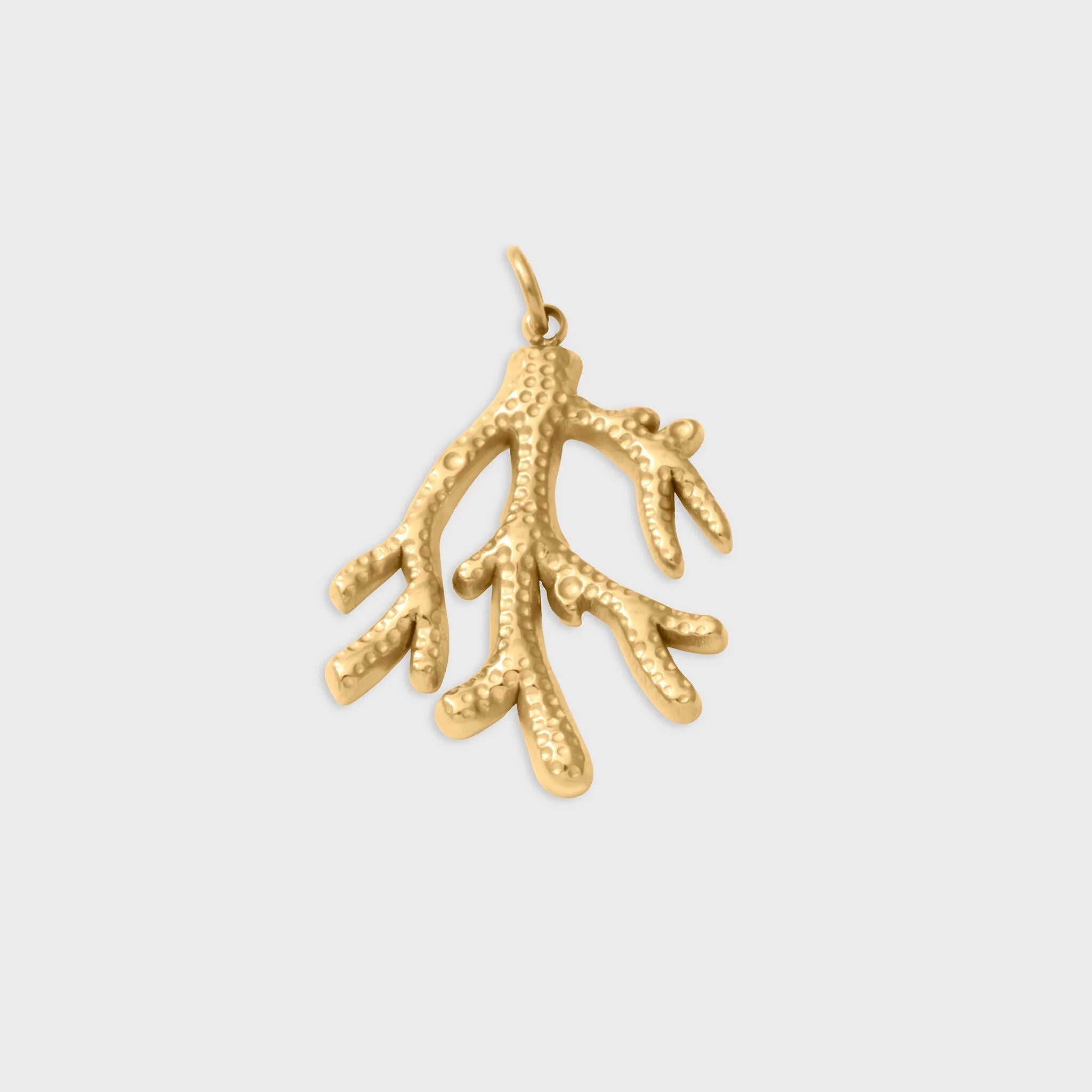 Gold coral-shaped pendant on a light gray background