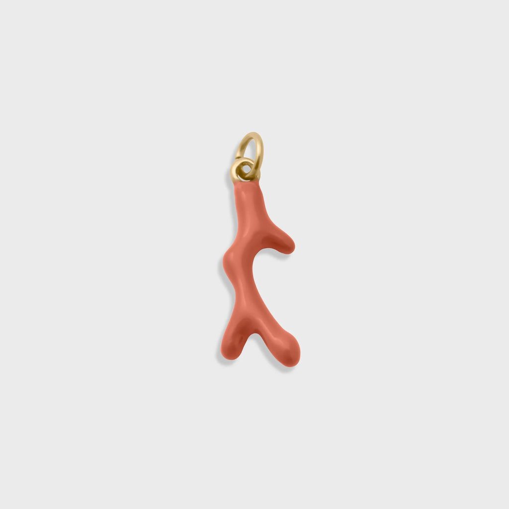 Coral-colored coral branch-shaped pendant with gold accent on a light gray background