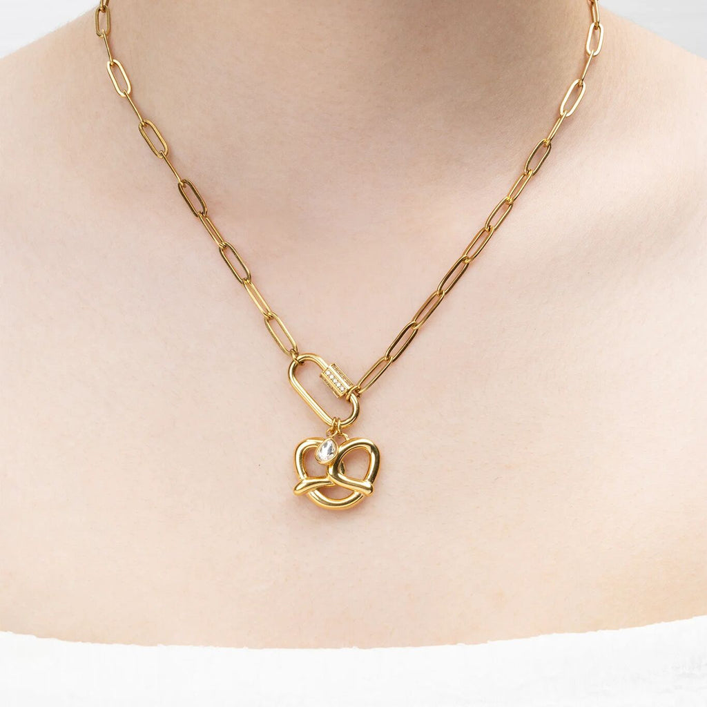 Gold necklace with a pretzel shaped pendant