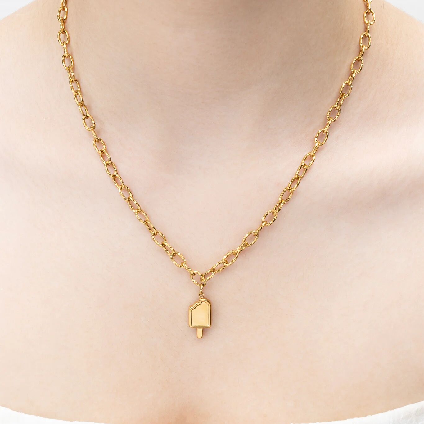 Gold necklace with a popsicle pendant