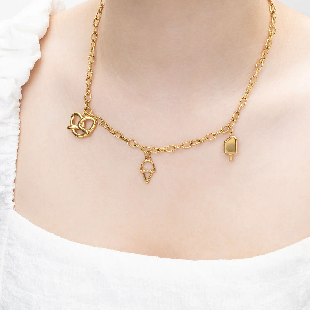 Gold necklace with charms