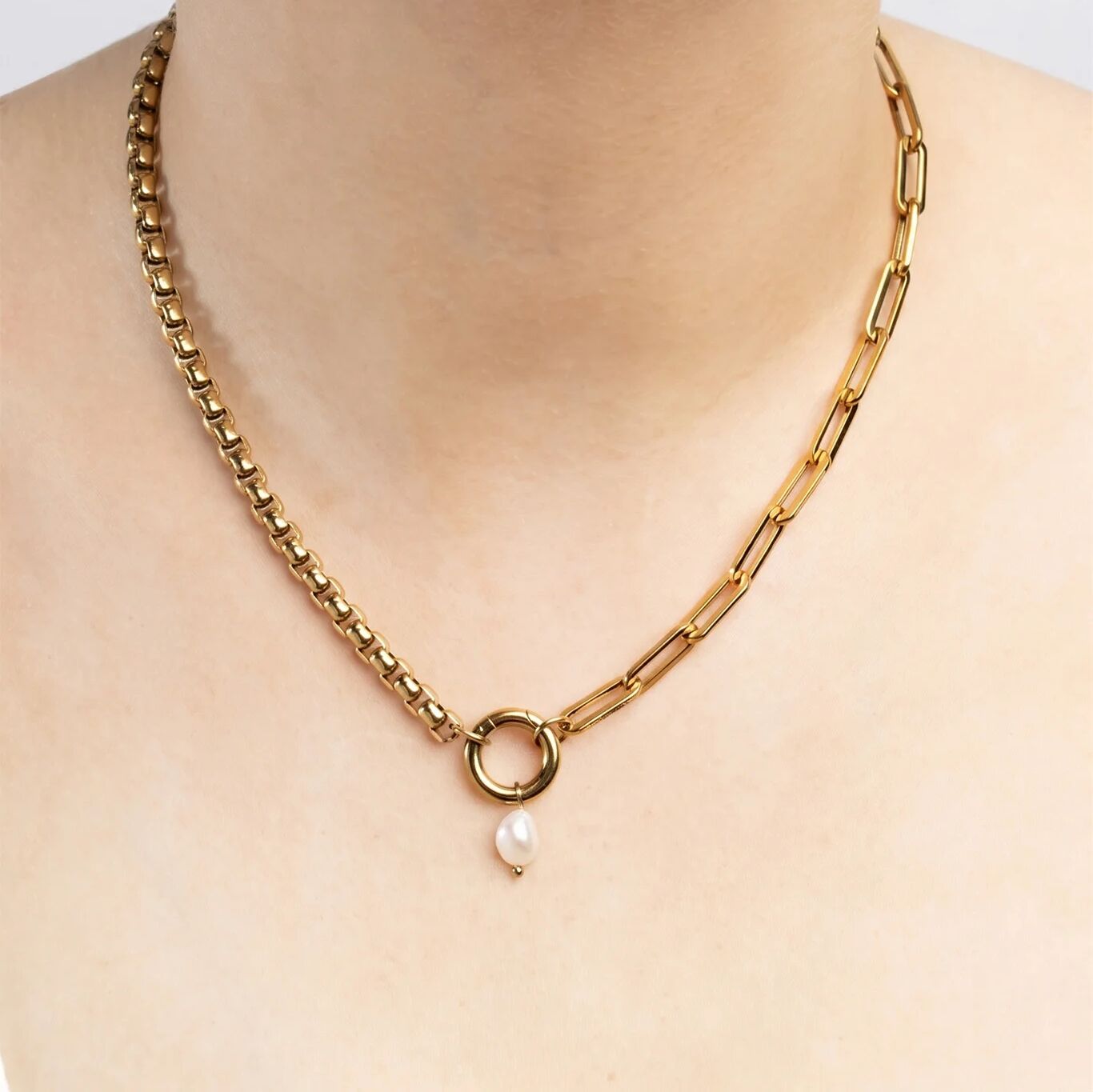 Gold chain necklace with a pearl pendant