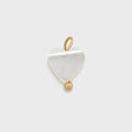 Gold Heart Shell Charm on a light gray background