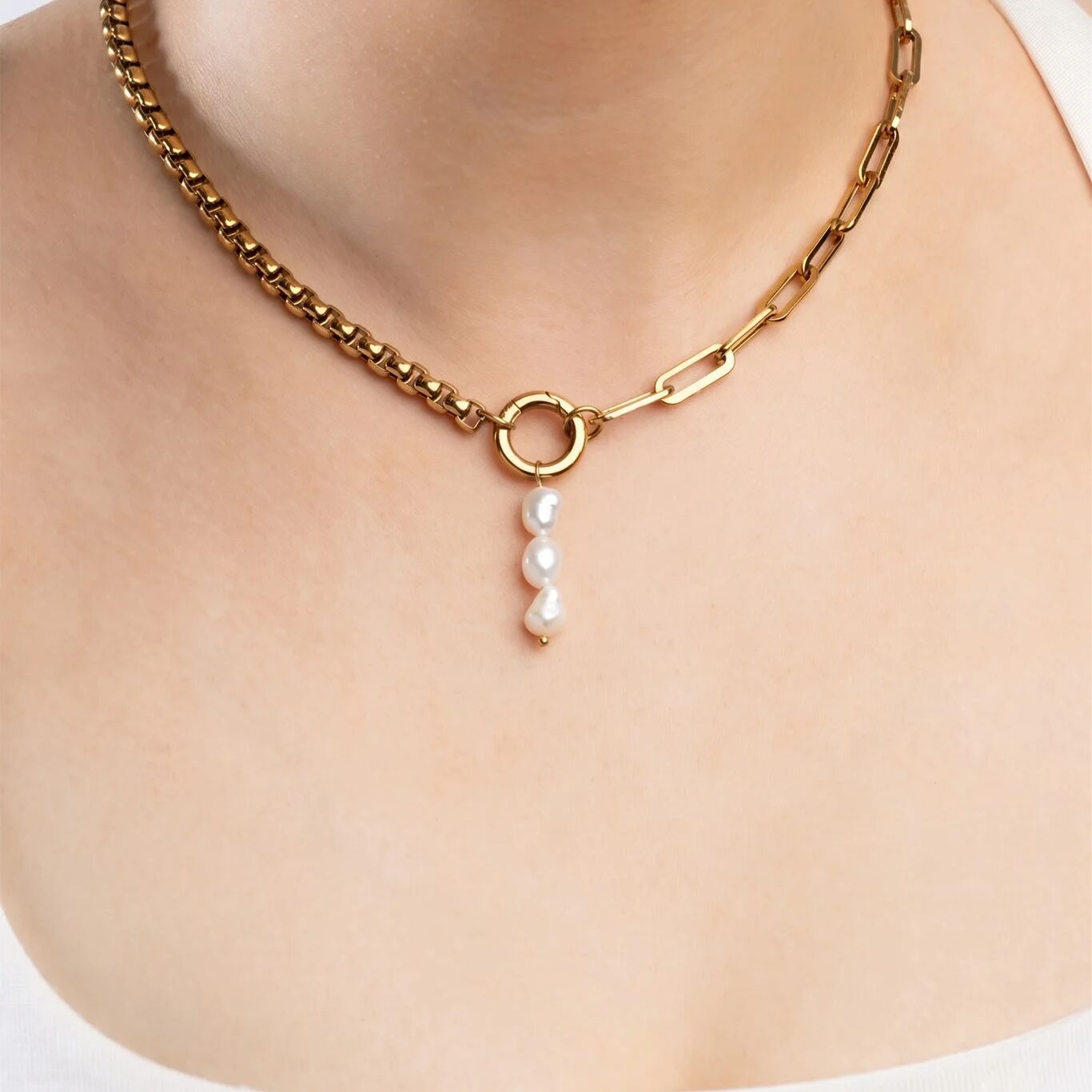 Gold chain necklace with a pearl pendant