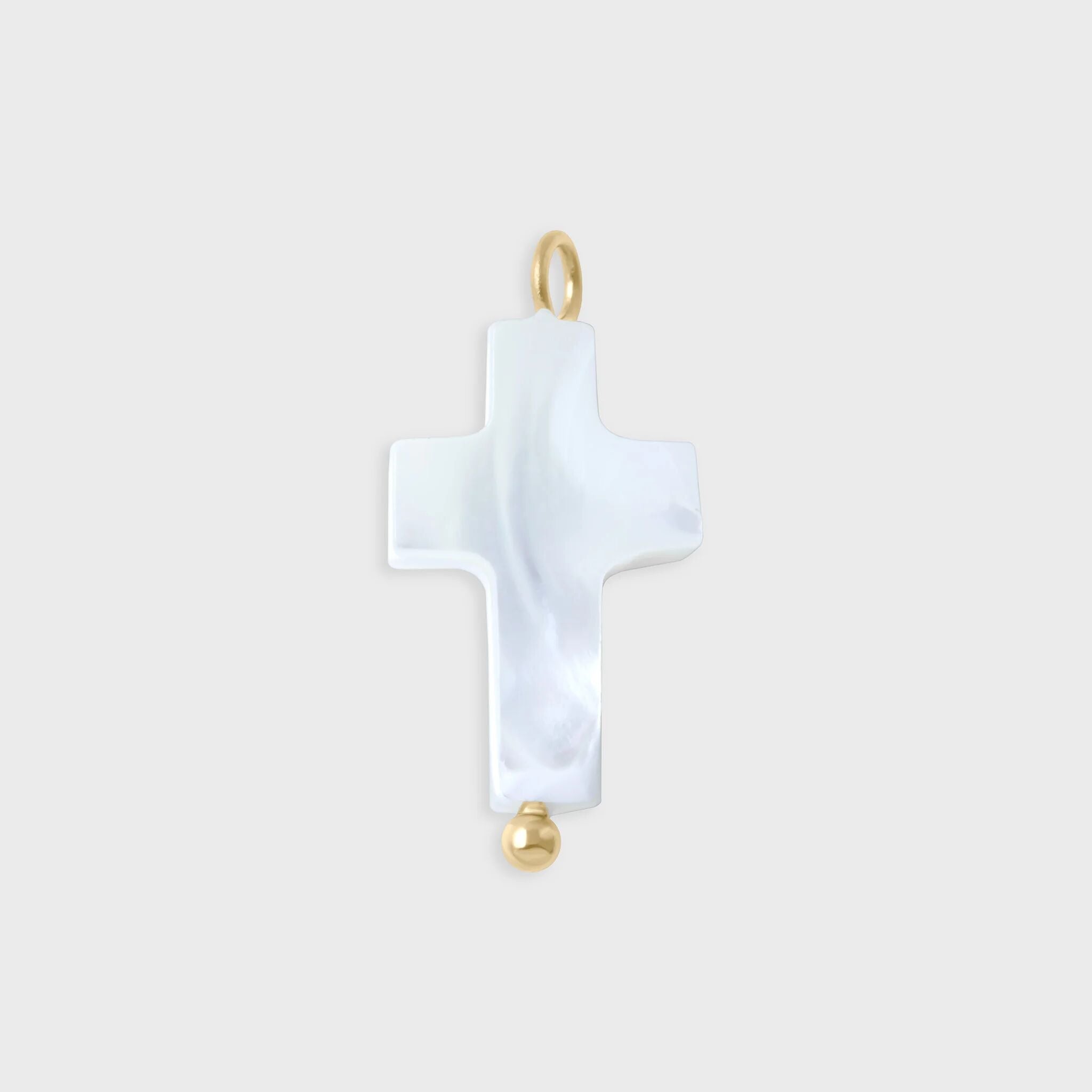 White cross-shaped pendant with gold accents on a light gray background