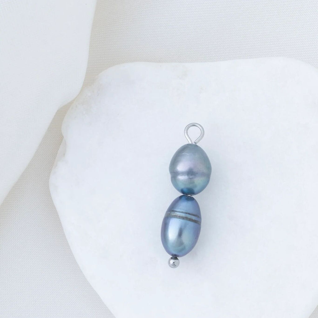 Black pearl pendant on a white background