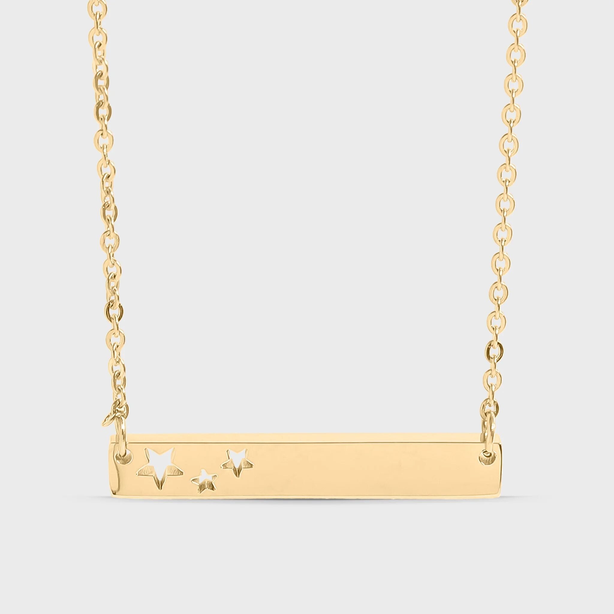 Gold necklace with star designs on a light gray background