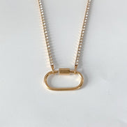 Ayla Clasp Necklace in gold tone featuring pearl accent