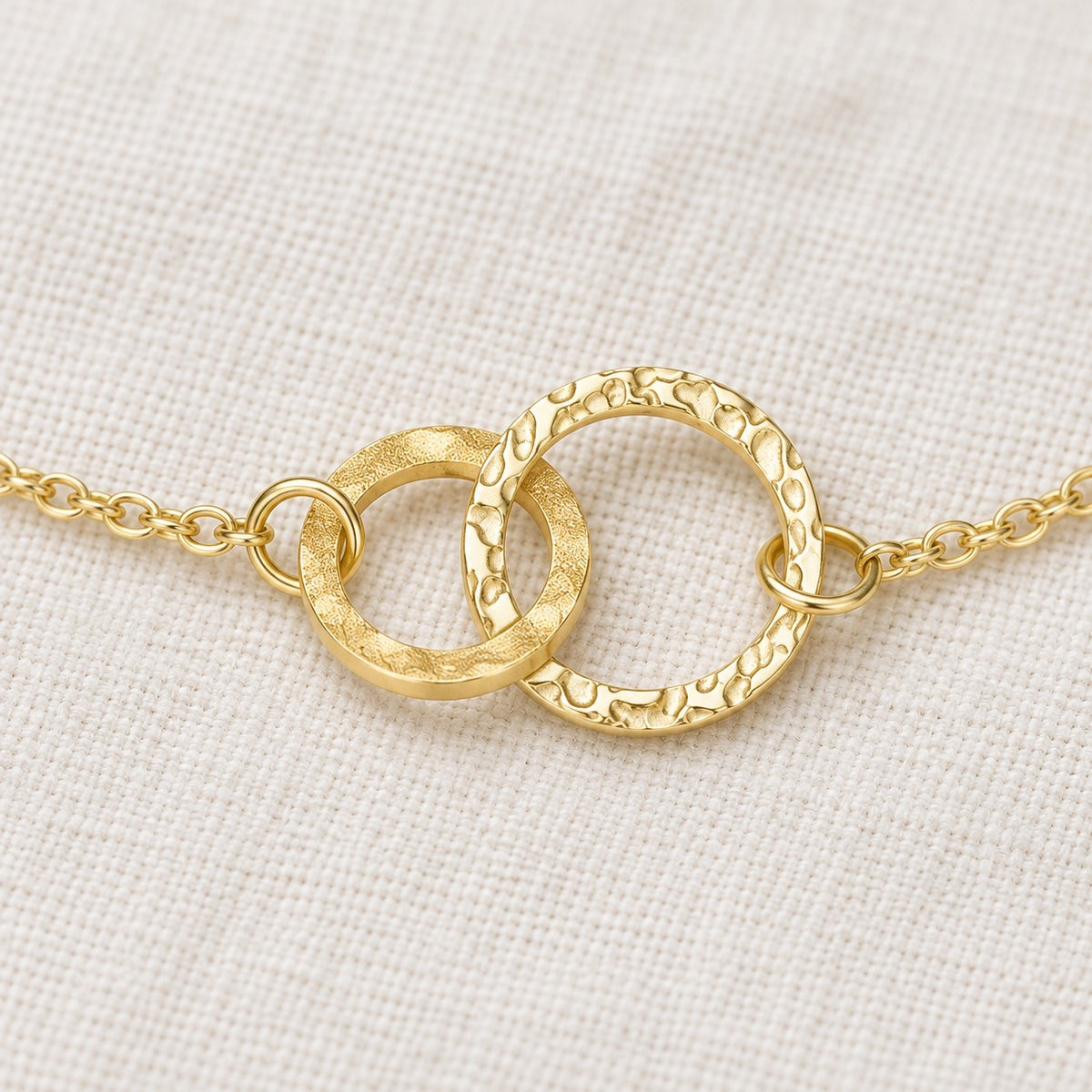 Amity Circle Bracelet — construction detail on ivory fabric; AI-generated supporting image.
