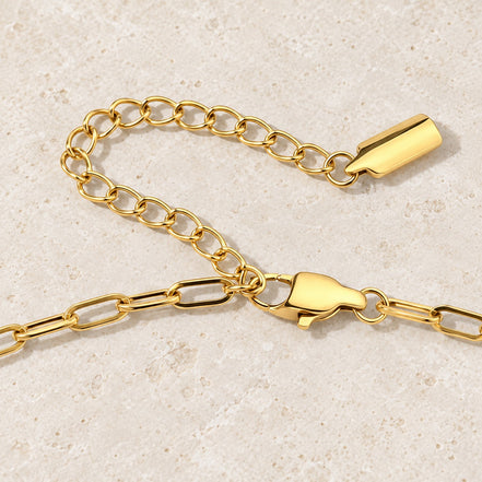 Arden Paperclip Necklace — gold clasp and chain detail; AI-generated supporting image.
