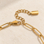 Nova Chain Bracelet in gold — lobster clasp and extension detail; AI-generated supporting image.