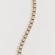 Rhea Link Bracelet — stones detail, gold with clear round stones; AI-generated supporting image.