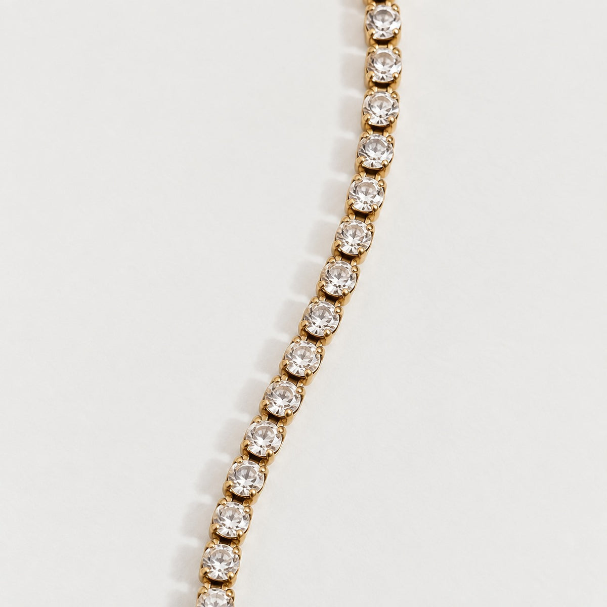 Rhea Link Bracelet — stones detail, gold with clear round stones; AI-generated supporting image.