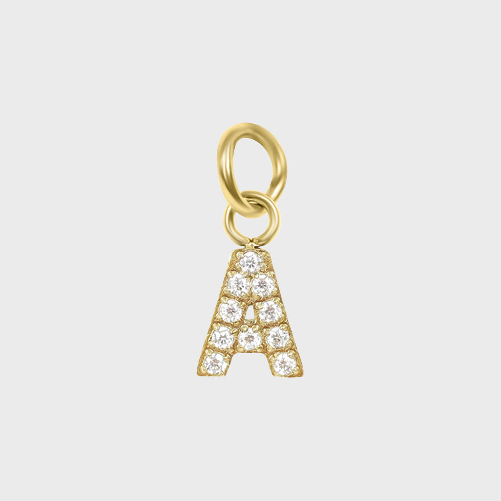 A gold-colored charm in the shape of the letter 'A' adorned with cubic zirconia stones.