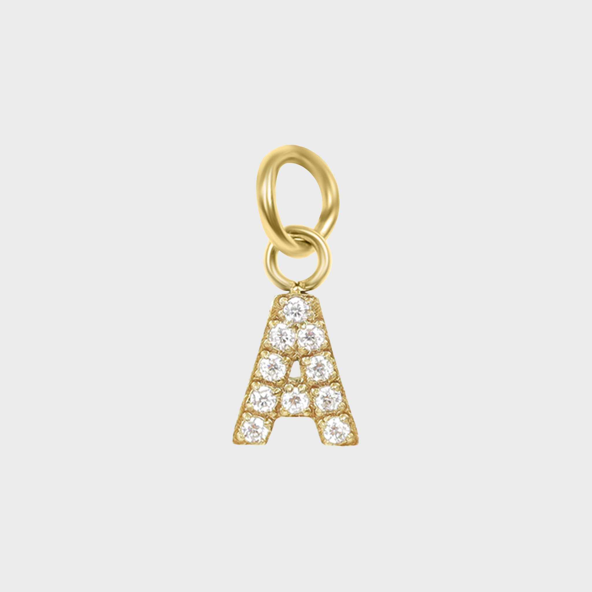 A gold-colored charm in the shape of the letter 'A' adorned with cubic zirconia stones.
